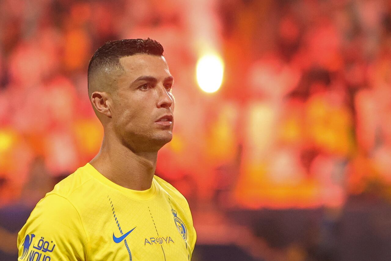 Nassr's Portuguese forward #07 Cristiano Ronaldo stands for the national anthem before the start of the Saudi Pro League football match between Al-Nassr and Al-Taawoun at King Saud University Stadium in Riyadh on August 18, 2023. (Photo by Fayez Nureldine / AFP)