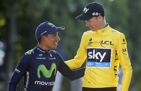PARIS, FRANCE - JULY 26: Chris Froome of Great Britain and Team Sky wearing the overall yellow jersey is congratulated by second place Nairo Quintana of Colombia and Movistar Team on the podium following stage twenty one of the 2015 Tour de France, a 109.5 km stage from Sevres to the Champs Elysees Avenue in Paris on July 26, 2015 in Paris, France. (Photo by Jean Catuffe/Getty Images)