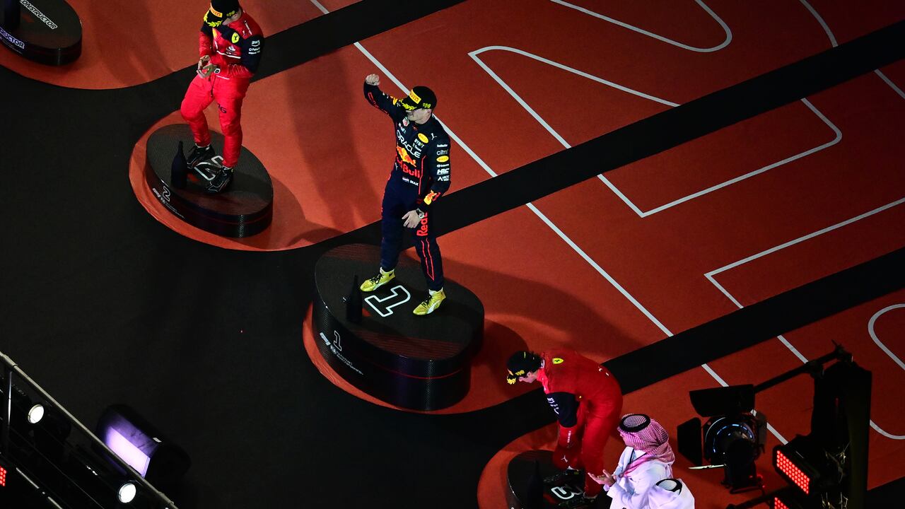 JEDDAH, SAUDI ARABIA - MARCH 27: Race winner Max Verstappen of the Netherlands and Oracle Red Bull Racing, Second placed Charles Leclerc of Monaco and Ferrari and Third placed Carlos Sainz of Spain and Ferrari on the podium during the F1 Grand Prix of Saudi Arabia at the Jeddah Corniche Circuit on March 27, 2022 in Jeddah, Saudi Arabia. (Photo by Clive Mason/Getty Images)