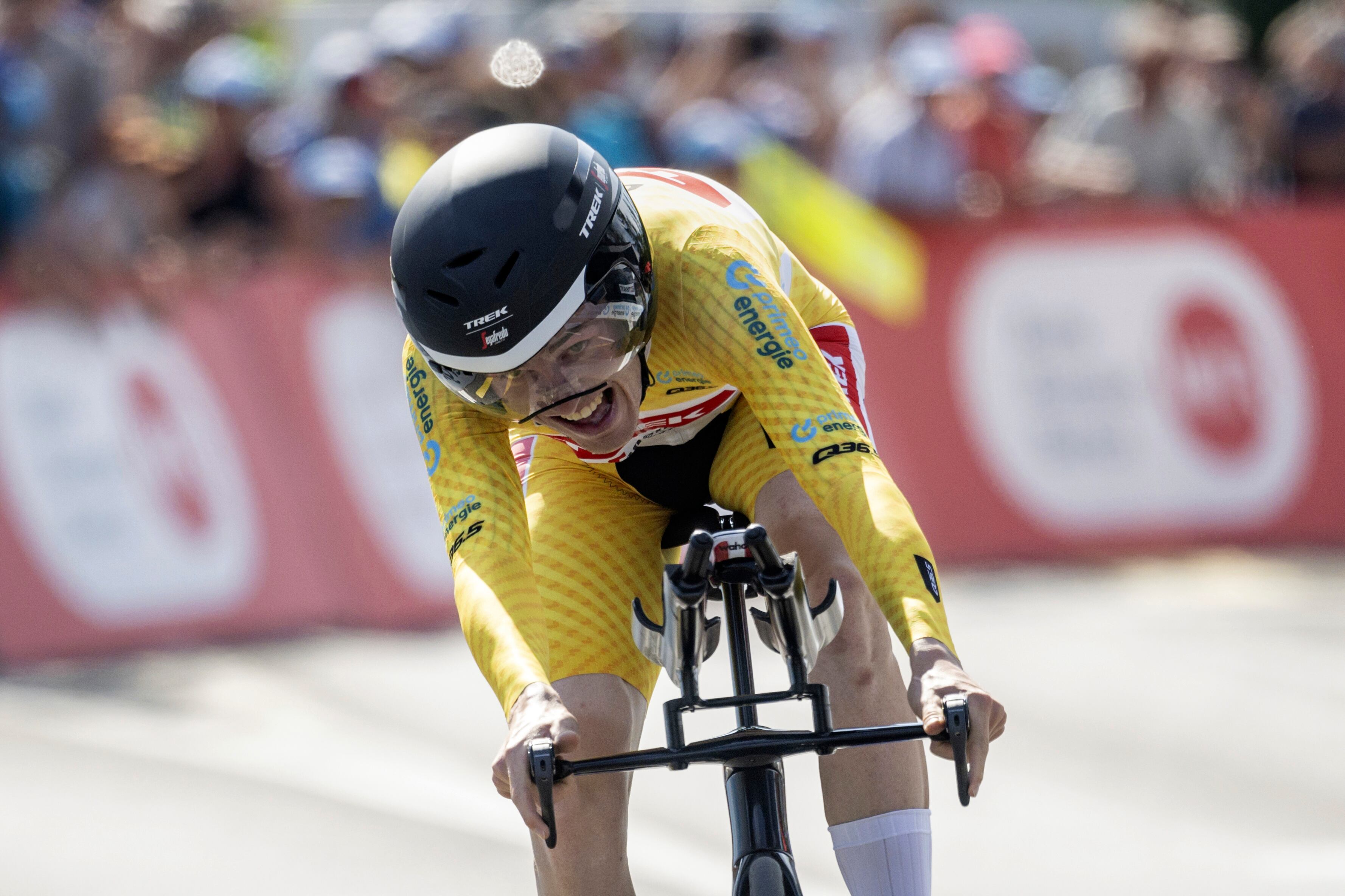 Denmark's Mattias Skjelmose crosses the finish line to win the Tour, during the eighth and final stage, a 25,7 km individual time trial, from St. Gallen to Abtwil, at the 86th Tour de Suisse cycling race, in Abtwil, Switzerland, Sunday, June 18, 2023. (Gian Ehrenzeller/Keystone via AP)
