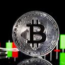 PARIS, FRANCE - JANUARY 08: In this photo illustration, a visual representation of the digital Cryptocurrency, Bitcoin is on display in front of the Bitcoin course's graph on January 08, 2021 in Paris, France. The value of Bitcoin (BTC) has exceeded the threshold of 41,000 dollars for the first time in history. The cryptocurrency continues its historic soar and just took $ 10,000 in five days on the optimism of the markets over the certification of Joe Biden's election in the United States, and continues its spectacular surge in recent weeks. (Photo illustration by Chesnot/Getty Images)