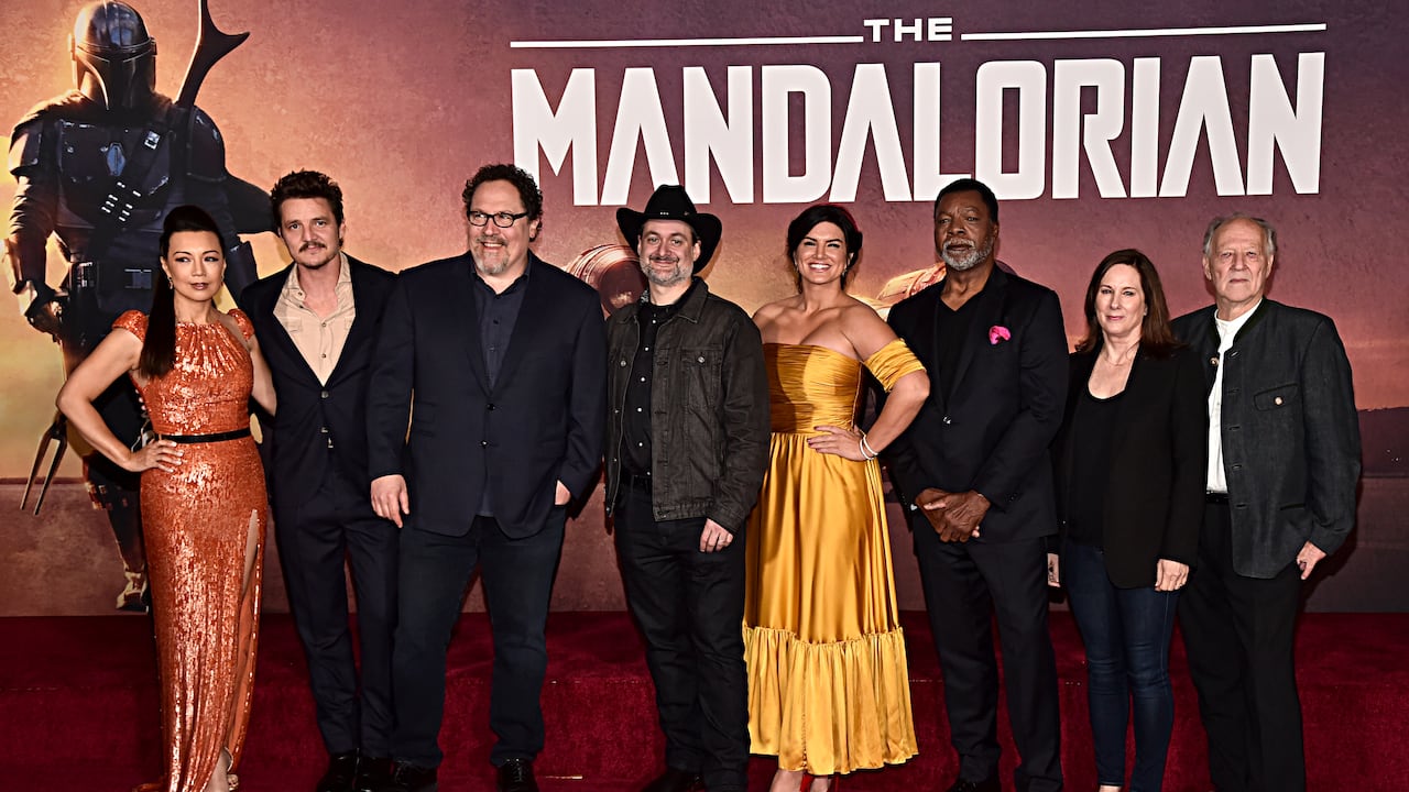 HOLLYWOOD, CALIFORNIA - NOVEMBER 13: (L-R) Ming-Na Wen, Pedro Pascal, Executive Producer Jon Favreau, Executive Producer/Director Dave Filoni, Gina Carano, Carl Weathers, Executive Producer Kathleen Kennedy and Werner Herzog arrive at the premiere of Lucasfilm's first-ever, live-action series, "The Mandalorian," at the El Capitan Theatre in Hollywood, Calif. on November 13, 2019. "The Mandalorian" streams exclusively on Disney+. (Photo by Alberto E. Rodriguez/Getty Images for Disney)