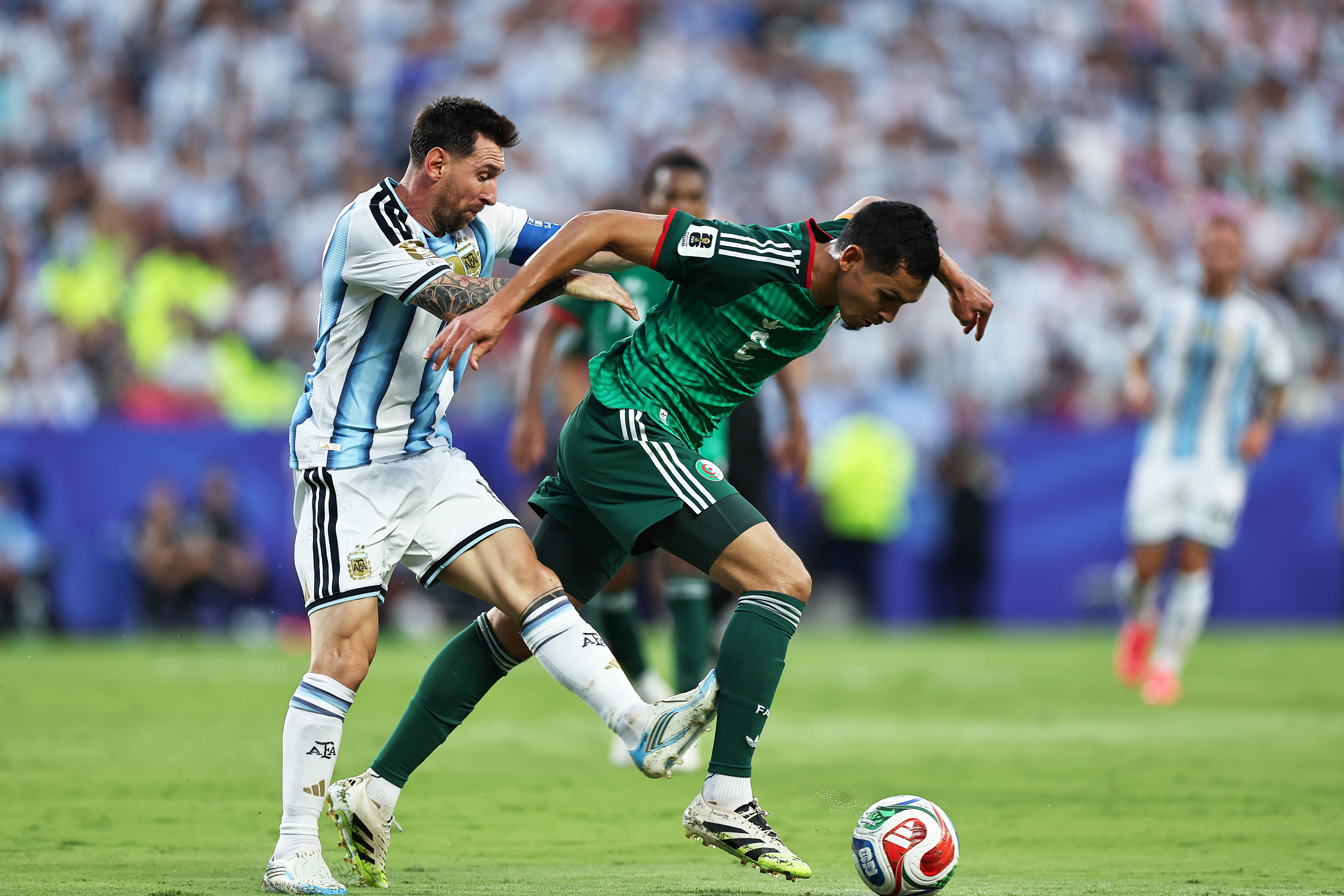 KANSAS CITY, MISSOURI - JUNE 16: Aïssa Mandi #2 of Algeria is marked by Lionel Messi #10 of Argentina during the FIFA World Cup 2026 Group J match between Argentina and Algeria at Kansas City Stadium on June 16, 2026 in Kansas City, Missouri. (Photo by Omar Vega/Getty Images)