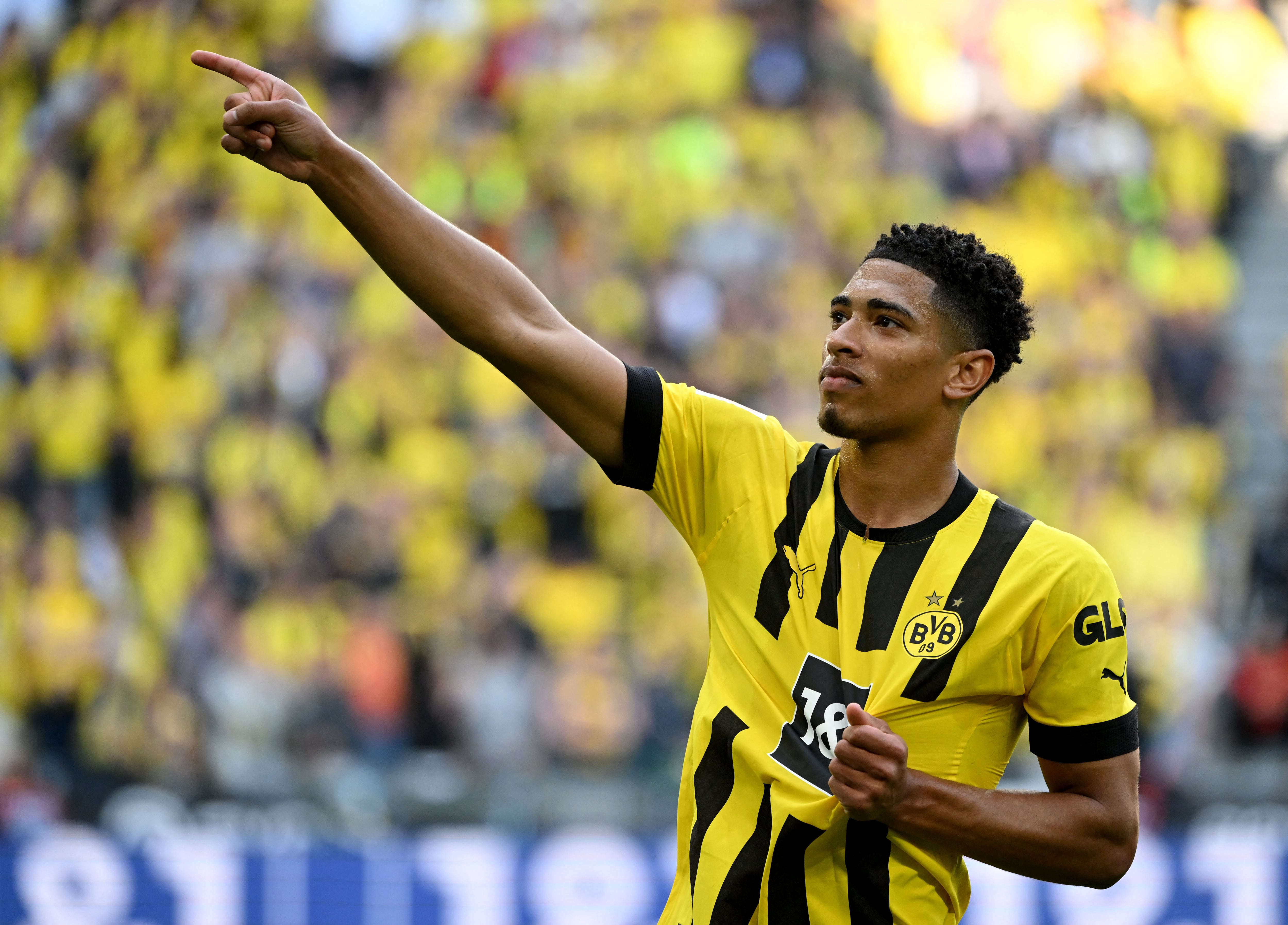 (FILES) Dortmund's English midfielder Jude Bellingham celebrates after scoring the 2-0 goal during the German first division Bundesliga football match between BVB Borussia Dortmund and Borussia Moenchengladbach in Dortmund, western Germany on May 13, 2023. English teenager Jude Bellingham will move from Borussia Dortmund to Real Madrid for a fee in excess of 100 million euros (USD 107 million), the German side announced on June 7, 2023. (Photo by INA FASSBENDER / AFP) / DFL REGULATIONS PROHIBIT ANY USE OF PHOTOGRAPHS AS IMAGE SEQUENCES AND/OR QUASI-VIDEO