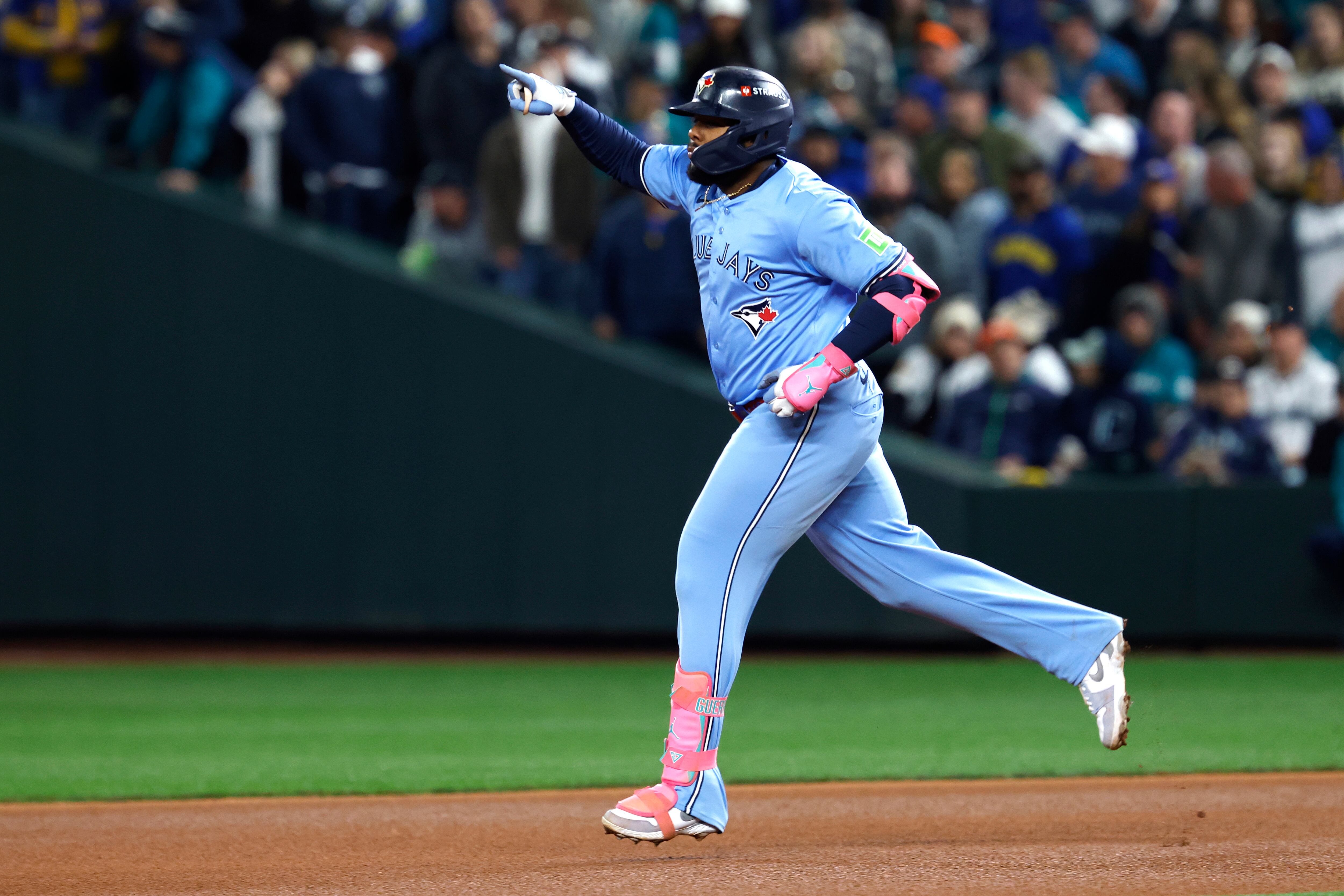 SEATTLE, WASHINGTON - OCTOBER 16: Vladimir Guerrero Jr. #27 of the Toronto Blue Jays rounds the bases after hitting a solo home run against the Seattle Mariners during the seventh inning in game four of the American League Championship Series at T-Mobile Park on October 16, 2025 in Seattle, Washington. (Photo by Alika Jenner/Getty Images)