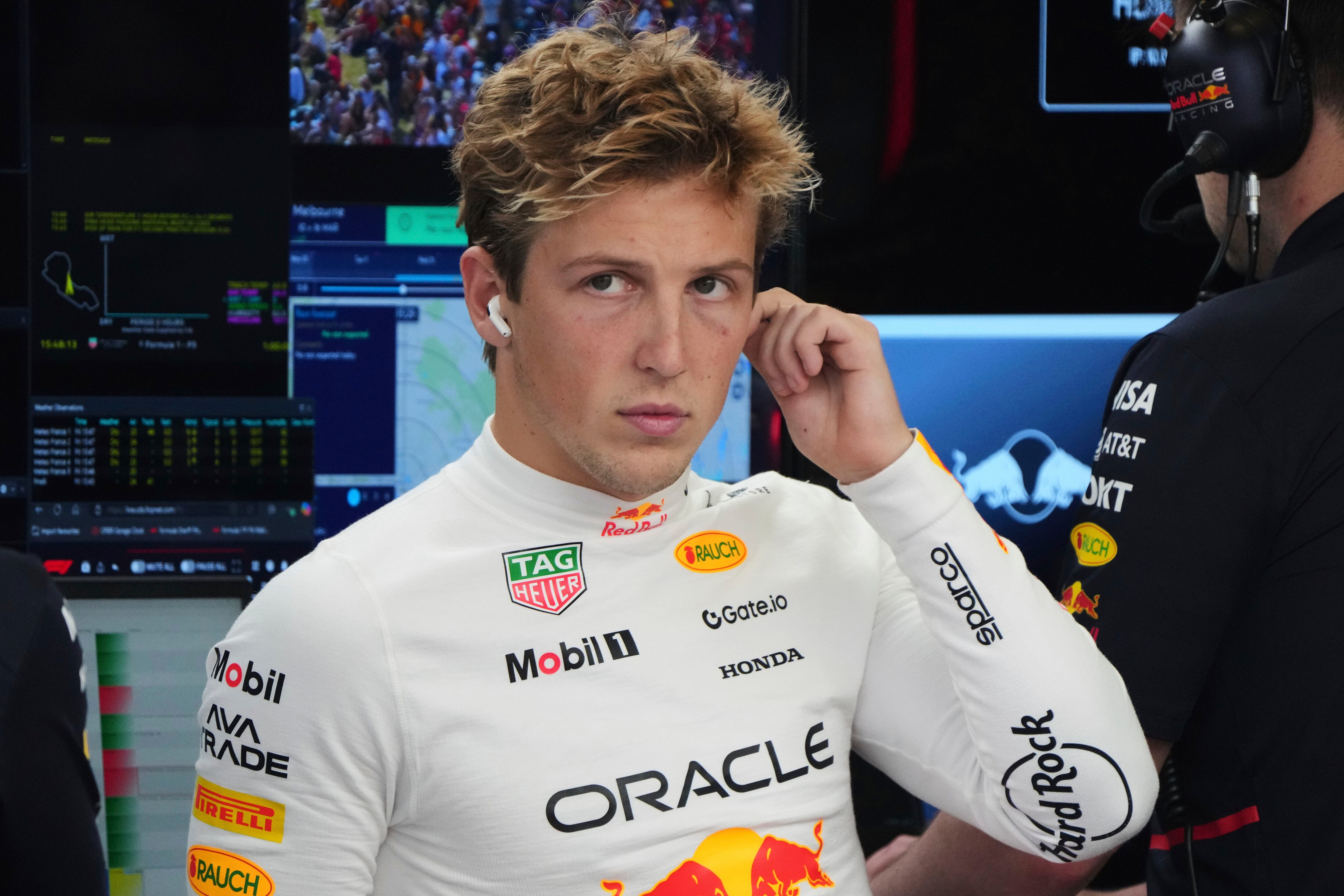Red Bull driver Liam Lawson of New Zealand reacts in his team garage during the second practice session for the Australian Formula One Grand Prix at Albert Park, in Melbourne, Australia, Friday, March 14, 2025. (AP Photo/Heath McKinley )