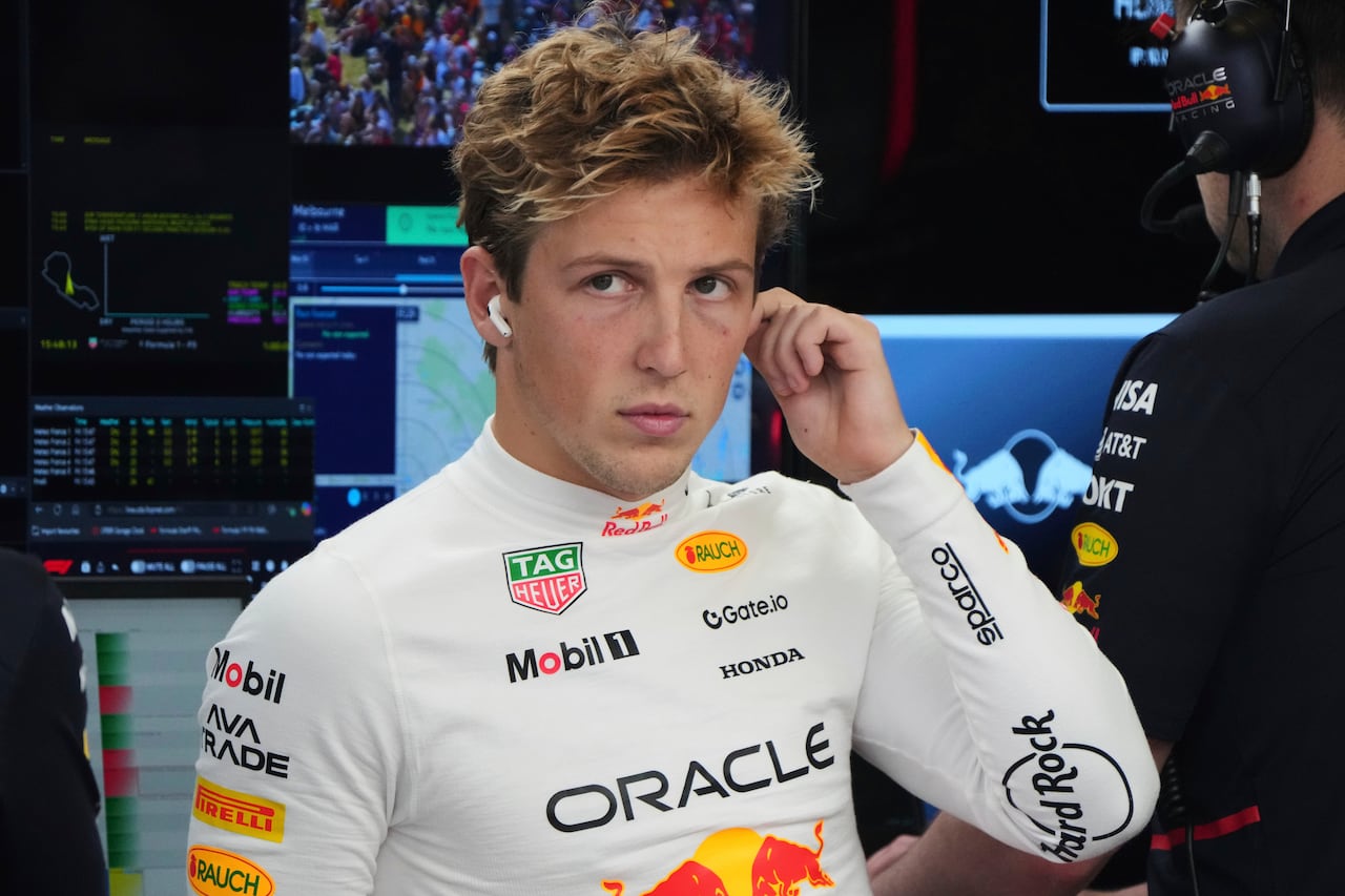 Red Bull driver Liam Lawson of New Zealand reacts in his team garage during the second practice session for the Australian Formula One Grand Prix at Albert Park, in Melbourne, Australia, Friday, March 14, 2025. (AP Photo/Heath McKinley )