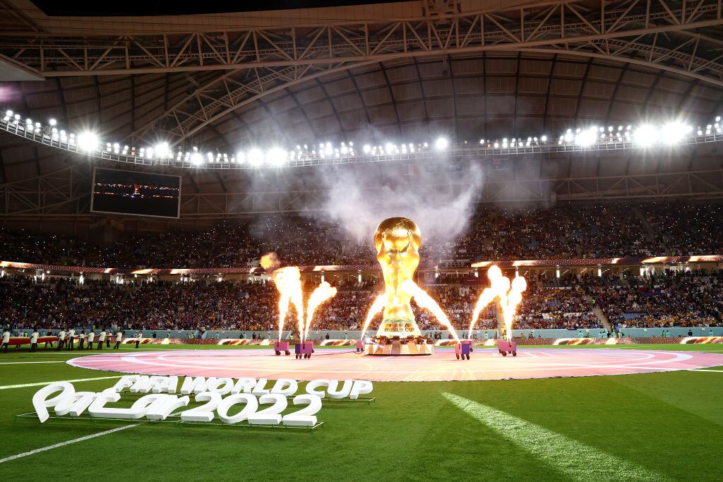 AL WAKRAH, QATAR - NOVEMBER 22: Pyrotechnics explode around a giant FIFA World Cup trophy prior to the FIFA World Cup Qatar 2022 Group D match between France and Australia at Al Janoub Stadium on November 22, 2022 in Al Wakrah, Qatar. (Photo by Robert Cianflone/Getty Images)