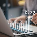 Businessman plan business growth and financial, increase of positive indicators in the year 2022 to increase business growth and an increase for growing up business "n