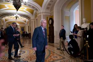 Senate Minority Leader Mitch McConnell, R-Ky., walks to speak with reporters at the Capitol in Washington, Wednesday, July 26, 2023. The 81-year-old GOP leader seemed to freeze at the lectern and was helped by other senators. McConnell went to his office for a few minutes and returned to speak with reporters. (AP Photo/J. Scott Applewhite)