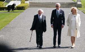 Irish President Michael D Higgins' dog Misneach looks on as US President Joe Biden walks with President Higgins and his wife Sabina at Aras an Uachtarain, in Phoenix Park, Dublin, on day three of his visit to the island of Ireland. Picture date: Wednesday April 12, 2023. (Photo by Brian Lawless/PA Images via Getty Images)