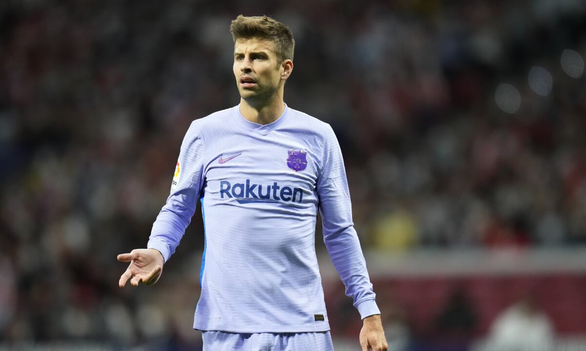 Barcelona's Gerard Pique gestures during the La Liga soccer match between Atletico Madrid and Barcelona at the Estadio Wanda Metropolitano in Madrid, Saturday, Oct. 2, 2021. (AP/Manu Fernández)