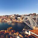oporto city with douro river and dom luiz bridge under blue sky, portugal.