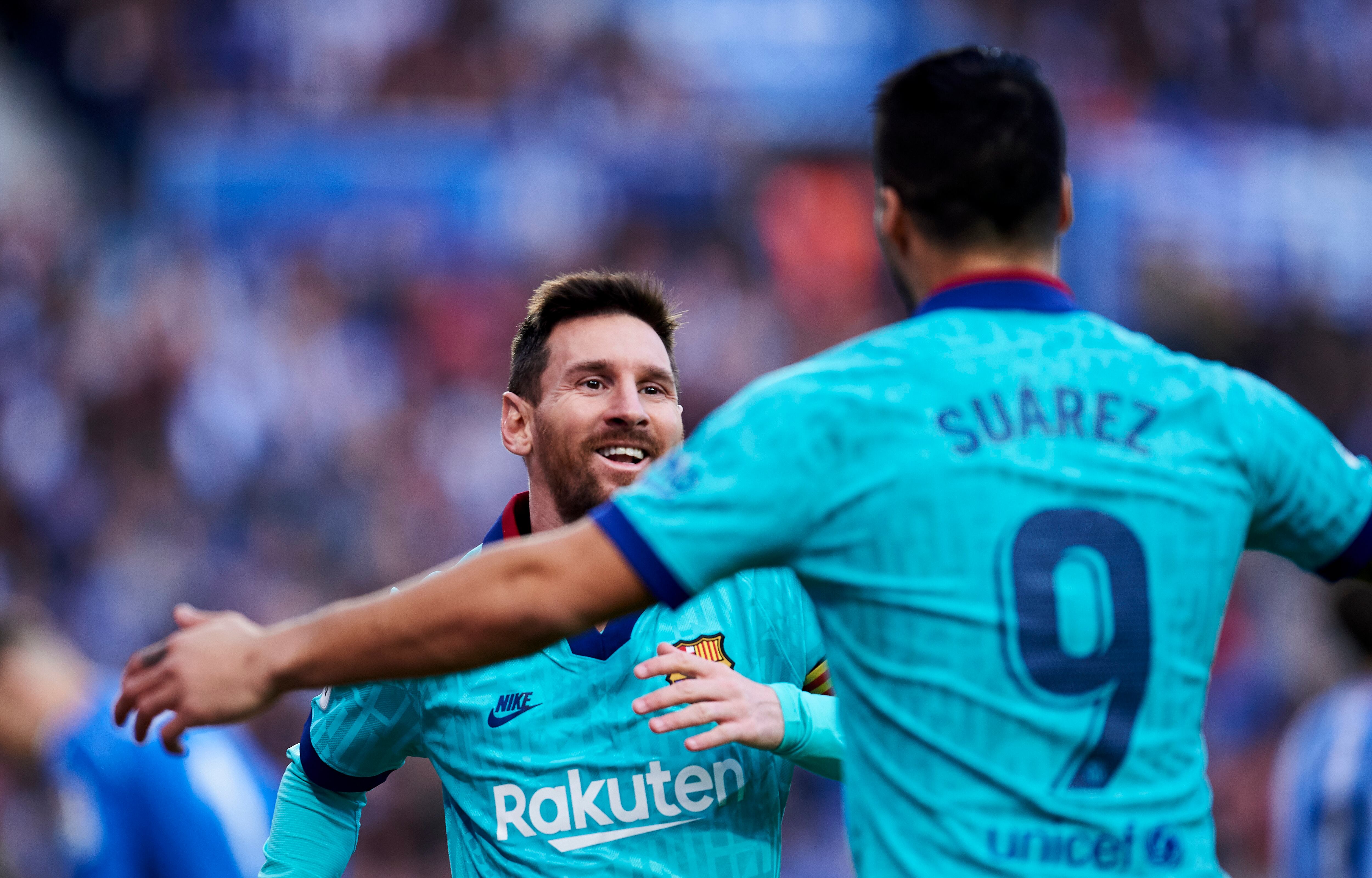 SAN SEBASTIAN, SPAIN - DECEMBER 14: Luis Suarez of FC Barcelona celebrates with teammate Lionel Messi after scoring his team's second goal during the Liga match between Real Sociedad and FC Barcelona at Estadio Anoeta on December 14, 2019 in San Sebastian, Spain. (Photo by Juan Manuel Serrano Arce/Getty Images)