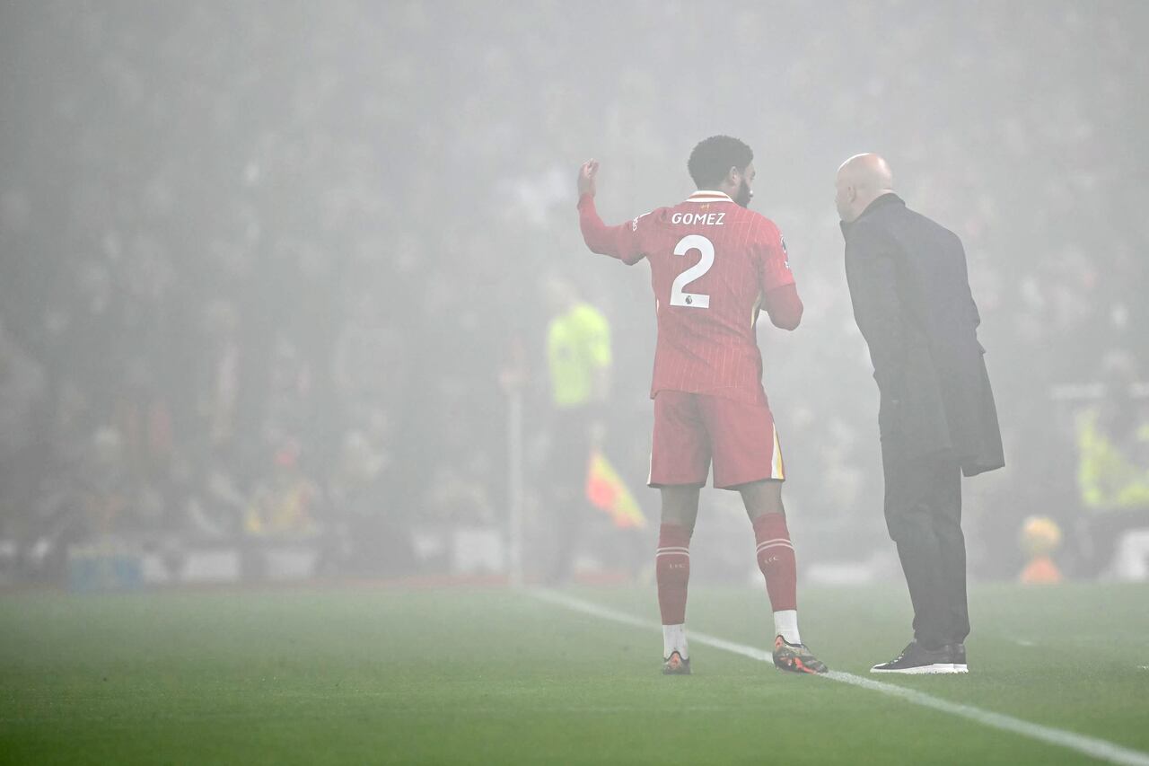 Liverpool's English defender #02 Joe Gomez talk to Liverpool's Dutch manager Arne Slot during the English Premier League football match between Liverpool and Leicester City at Anfield in Liverpool, north west England on December 26, 2024. (Photo by Paul ELLIS / AFP) / RESTRICTED TO EDITORIAL USE. No use with unauthorized audio, video, data, fixture lists, club/league logos or 'live' services. Online in-match use limited to 120 images. An additional 40 images may be used in extra time. No video emulation. Social media in-match use limited to 120 images. An additional 40 images may be used in extra time. No use in betting publications, games or single club/league/player publications. /