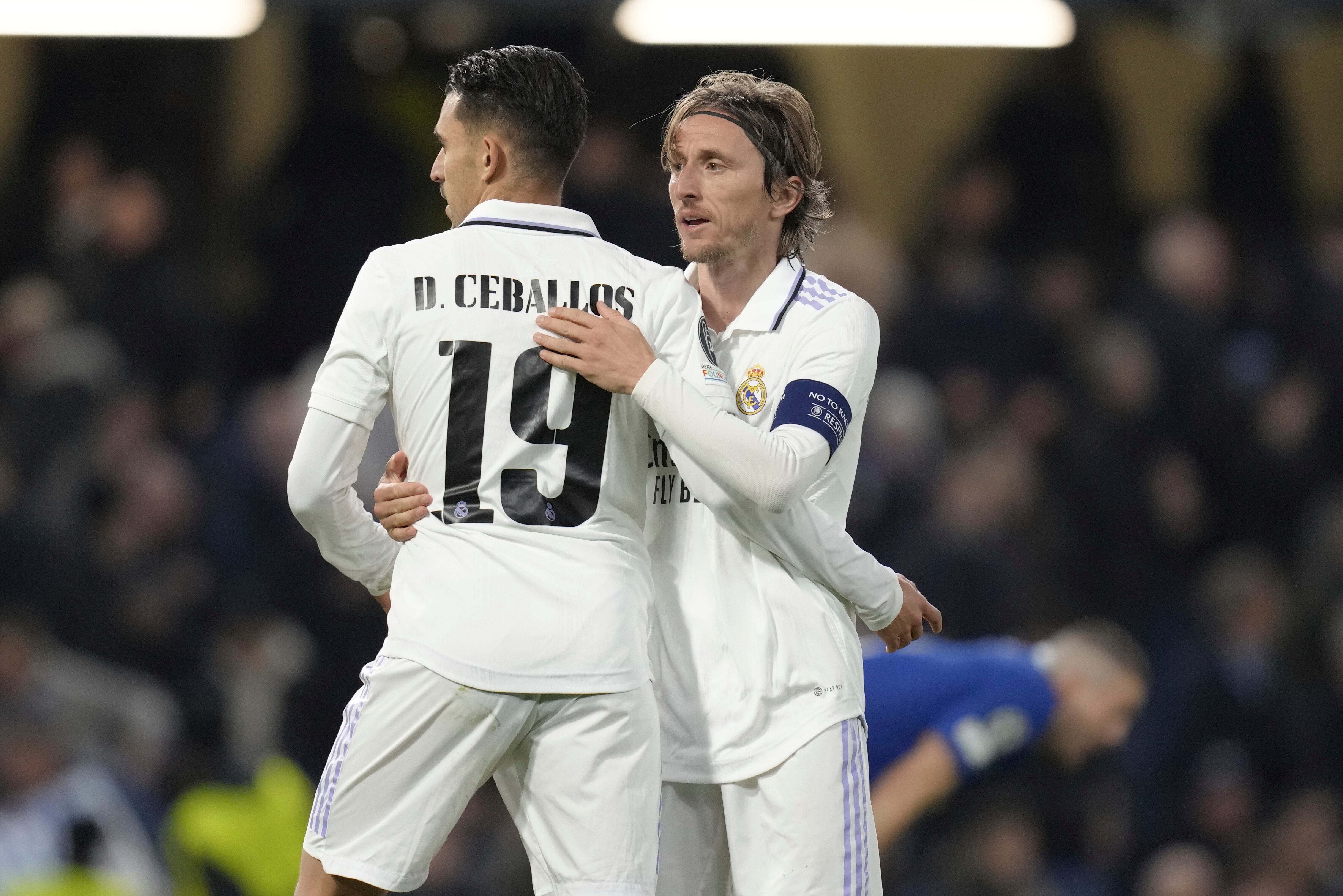 Real Madrid's Luka Modric, right, and Real Madrid's Dani Ceballos celebrate after the Champions League quarterfinal second leg soccer match between Chelsea and Real Madrid at Stamford Bridge stadium in London, Tuesday, April 18, 2023. (AP Photo/Kirsty Wigglesworth)