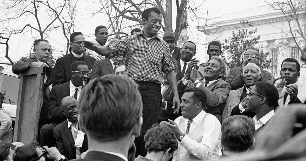 The author James Baldwin smiles while addressing the crowd from the speaker's platform, after participating in the march from Selma to Montgomery in support of voting rights, Alabama, March 1965. (Photo by Robert Abbott Sengstacke/Getty Images)