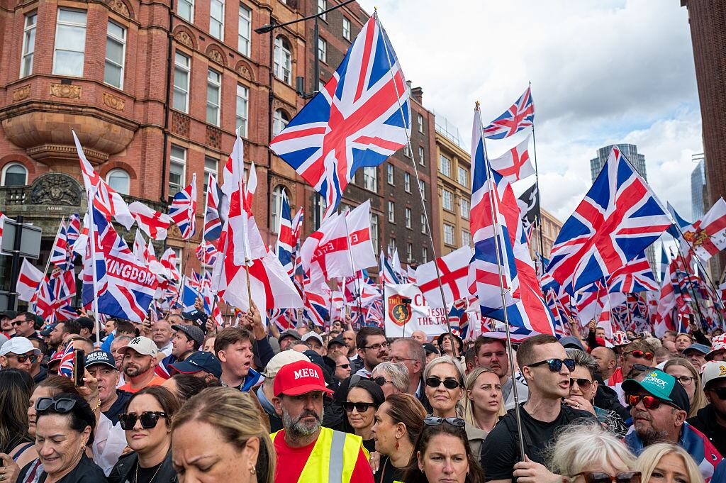 LONDON, ENGLAND - SEPTEMBER 13: Crowds gather during the Unite The Kingdom rally in Central London on September 13, 2025 in London, England. Far-right activist Tommy Robinson (also known as Stephen Yaxley-Lennon) has invited supporters to hold a rally in central London entitled "Unite The Kingdom". The former English Defence League leader and his supporters are actively islamaphobic and racist and have been behind much of the unrest seen outside hotels housing migrants this summer. Stand Up To Racism are mounting a counter-protest to today's rally. (Photo by Ben Montgomery/Getty Images)