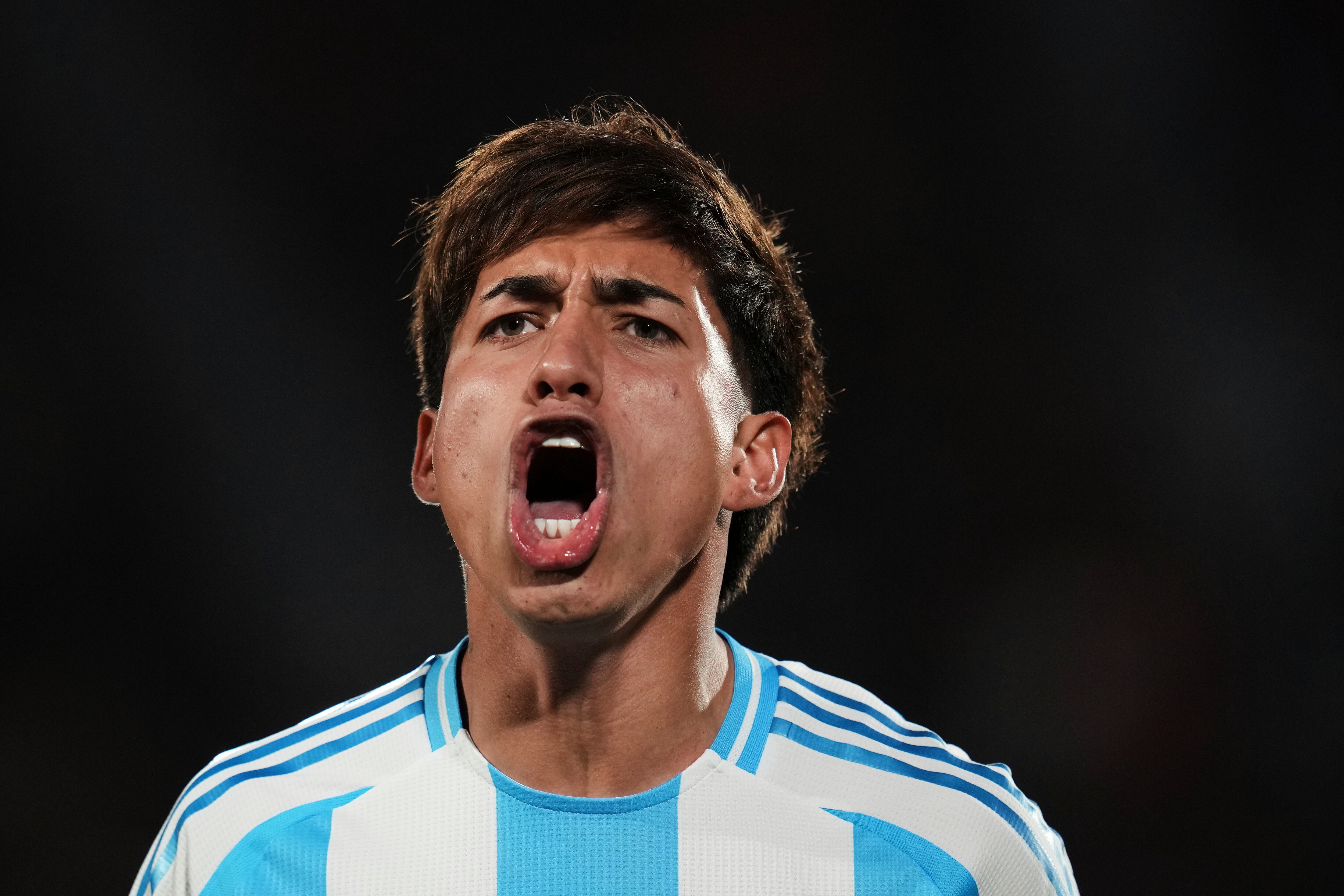 Argentina's Maher Carrizo celebrates scoring his side's first goal against Mexico during a FIFA U-20 World Cup quater-final soccer match at National Stadium in Santiago, Chile, Saturday, Oct. 11, 2025. (AP Photo/Esteban Felix)