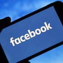 PARIS, FRANCE - JANUARY 31: In this photo illustration the Facebook logo is seen on the screen of an iPhone on January 31, 2019 in Paris, France. The social media Facebook revealed to have paid teenagers to watch their activities on their phone. The company has offered Internet users to download the application "Facebook Research" to observe all their deeds and actions, against payment. Despite this, Facebook shares soar by 11% in the wake of the announcement of a net profit up 61% to $ 6.9 billion for the last quarter of 2018.(Photo by Chesnot/Getty Images)