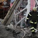 This handout photograph taken and released by the State Emergency Service of Ukraine on December 29, 2023, shows a Ukrainian firefighter working at a site after a rocket attack in the city of Kharkiv, amid the Russian invasion of Ukraine. Russia launched drone and missile strikes across Ukraine on December 29, 2023, killing at least 12 people and wounding over 70 in one of the biggest air attacks of the war. (Photo by Handout / State Emergency Service of Ukraine / AFP) / RESTRICTED TO EDITORIAL USE - MANDATORY CREDIT "AFP PHOTO / HO/ State Emergency Service of Ukraine" - NO MARKETING NO ADVERTISING CAMPAIGNS - DISTRIBUTED AS A SERVICE TO CLIENTS