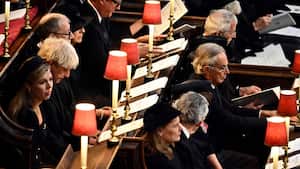 Former British Prime Ministers from left, Boris Johnson and his wife Carrie, Theresa May and her husband Philip, David Cameron and his wife Samantha, front row, Gordon Brown and his wife Sarah, Tony Blair and his wife Cherie and John Major and his wife Norma attend the funeral service of Queen Elizabeth II at Westminster Abbey in central London, Monday Sept. 19, 2022. The Queen, who died aged 96 on Sept. 8, will be buried at Windsor alongside her late husband, Prince Philip, who died last year. (Ben Stansall/Pool via AP)