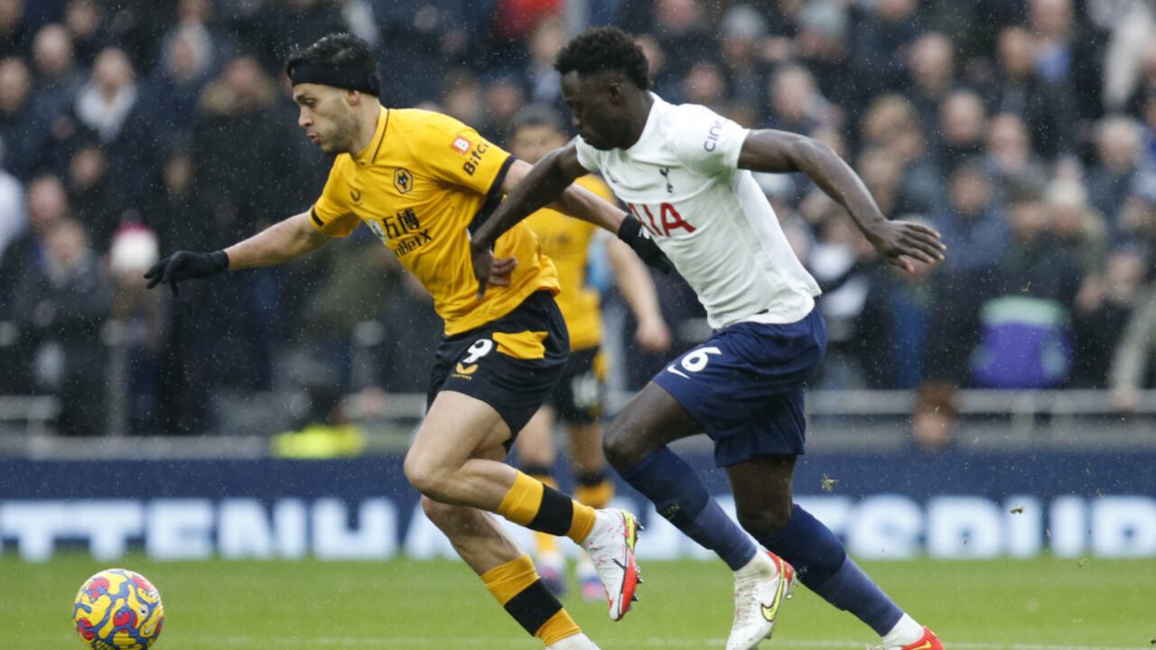 Wolverhampton Wanderers' Raul Jimenez, left vies for the ball with Tottenham's Davinson Sanchez during the English Premier League soccer match between Tottenham Hotspur and Wolverhampton Wanderers and at White Hart Lane in London, Sunday, Feb. 13, 2022. (AP/David Cliff)