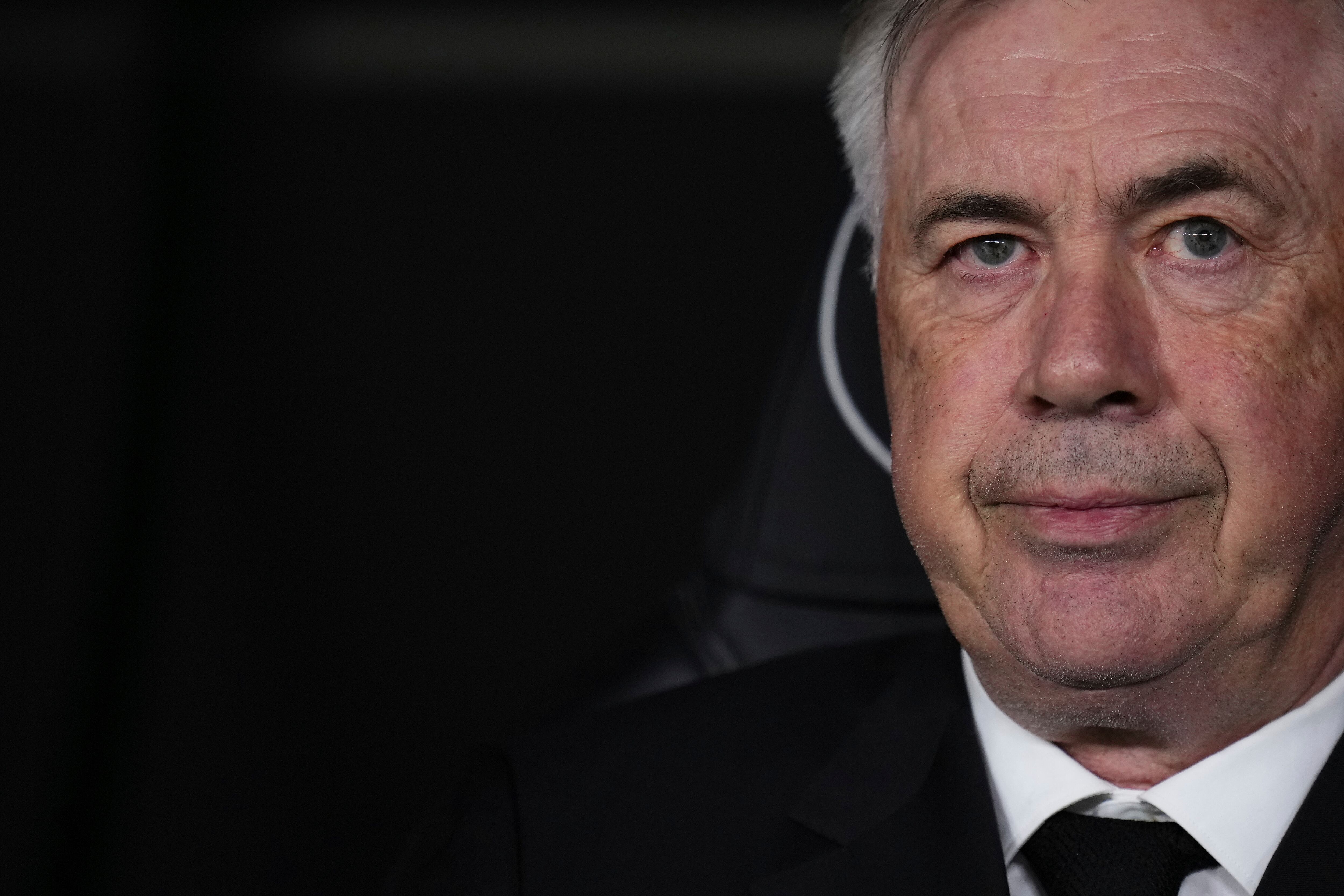 Real Madrid's head coach Carlo Ancelotti waits for the start of the Spanish La Liga soccer match between Real Madrid and Celta Vigo at the Santiago Bernabeu stadium in Madrid, Spain, Saturday, April 22, 2023. (AP Photo/Manu Fernandez)