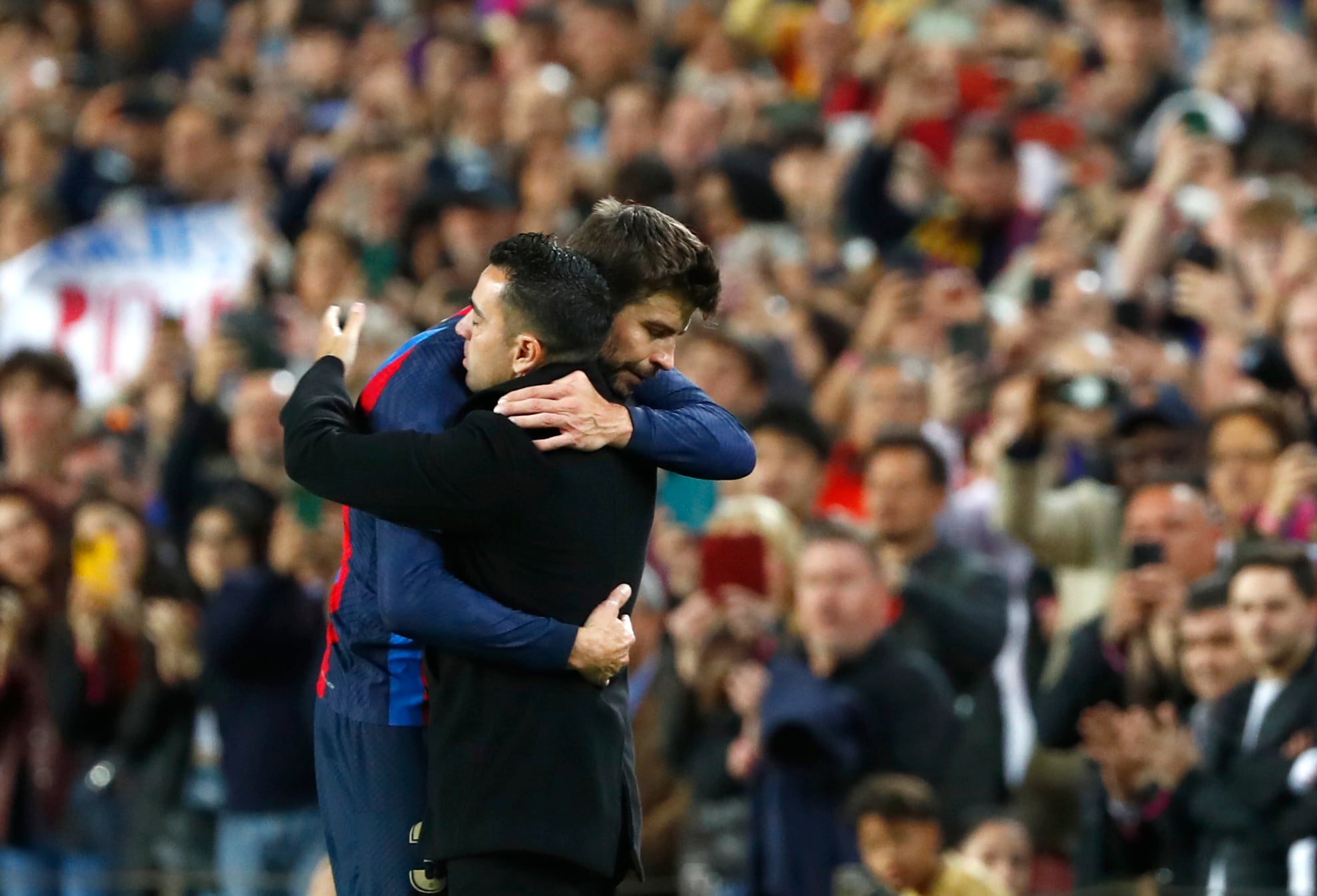 Barcelona's Gerard Pique and Barcelona's head coach Xavi Hernandez after the Spanish La Liga soccer match between Barcelona and Almeria at the Camp Nou stadium in Barcelona, Spain, Saturday, Nov. 5, 2022. (AP Photo/Joan Monfort)