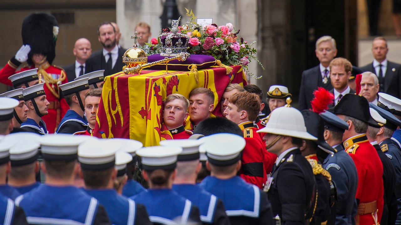 The coffin of Queen Elizabeth II is placed on a gun carriage during her funeral service in Westminster Abbey in central London Monday Sept. 19, 2022.The Queen, who died aged 96 on Sept. 8, will be buried at Windsor alongside her late husband, Prince Philip, who died last year. (AP Photo/Emilio Morenatti,Pool)