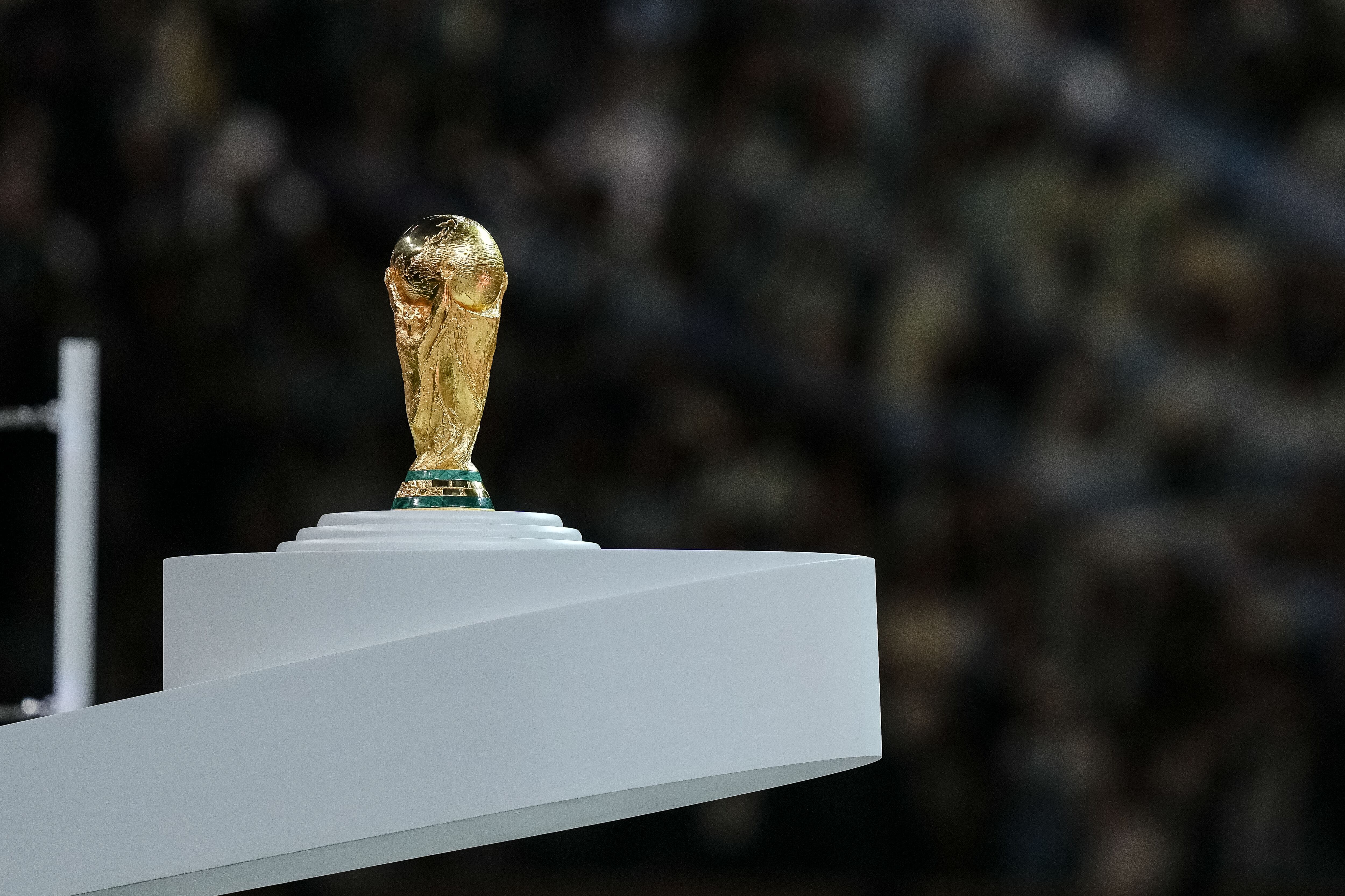 LUSAIL CITY, QATAR - DECEMBER 18: the World Cup trophy on its pedestal after the FIFA World Cup Qatar 2022 Final match between Argentina and France at Lusail Stadium on December 18, 2022 in Lusail City, Qatar. (Photo by Mohammad Karamali/Defodi Images via Getty Images)