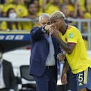 Colombia's coach Reinaldo Rueda gives direction to his player Colombia's Wilmar Barrios during a qualifying soccer match against Peru for the FIFA World Cup Qatar 2022 at Roberto Melendez stadium in Barranquilla, Colombia, Friday, Jan. 28, 2022. (AP Photo/Fernando Vergara)