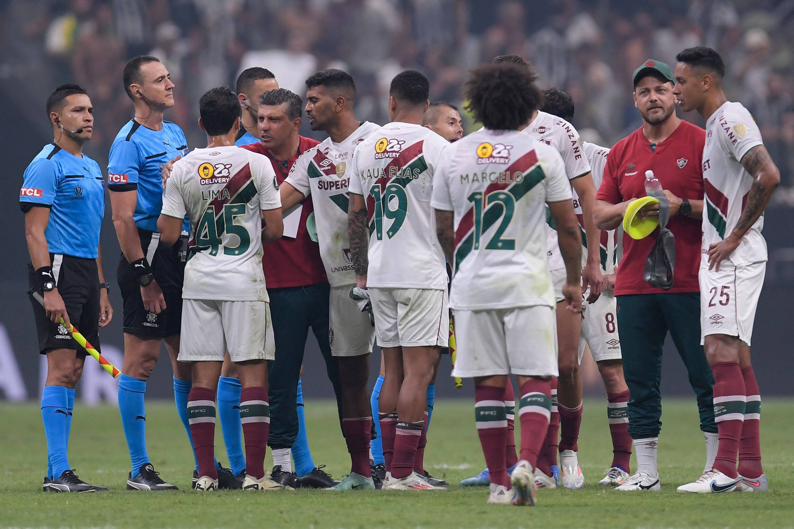 Fluminense players react after losing during the Copa Libertadores all-Brazilian quarter-final second leg football match between Atletico Mineiro and Fluminense at the Arena MRV stadium in Belo Horizonte, Brazil, on September 25, 2024. (Photo by DOUGLAS MAGNO / AFP)
