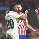 MADRID, SPAIN - SEPTEMBER 18: Vinicius Junior of Real Madrid argues with Yannick Carrasco and Reinildo Mandava of Atletico de Madridd during the LaLiga Santander match between Atletico de Madrid and Real Madrid CF at Civitas Metropolitano Stadium on September 18, 2022 in Madrid, Spain. (Photo by Angel Martinez/Getty Images)