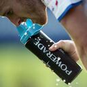 Close up of a player spitting out water from a Powerade bottle (Photo by AMA/Corbis via Getty Images)