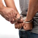 Handcuffed Man Being Released