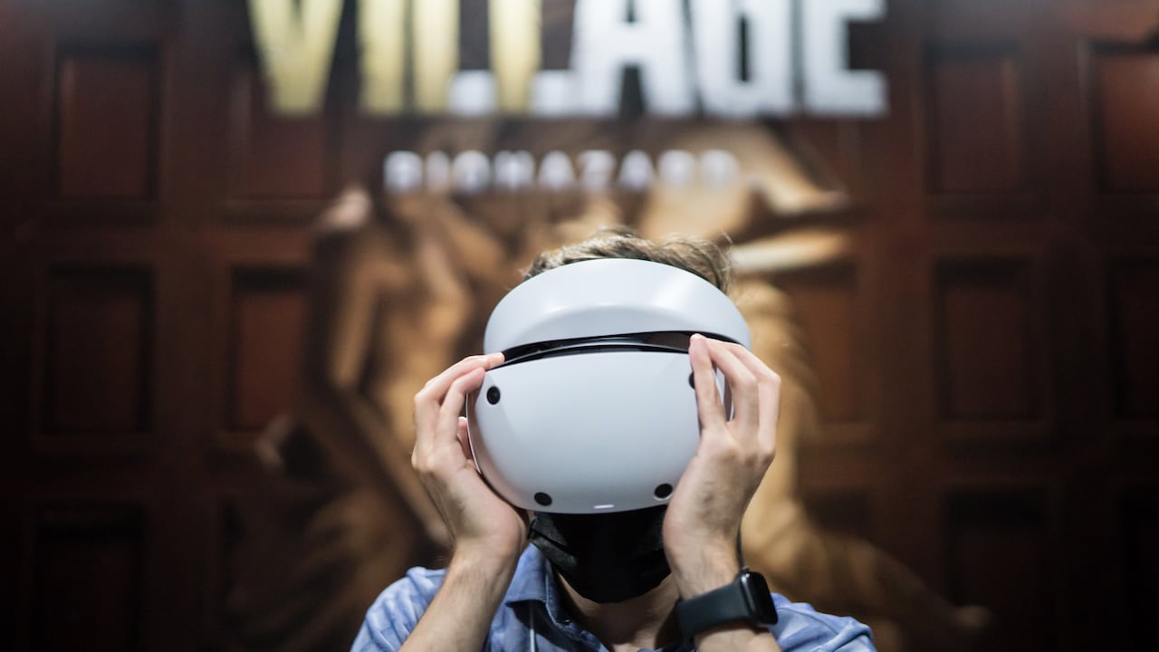 CHIBA, JAPAN - SEPTEMBER 15: An attendee wears a Sony PlayStation VR2 (PS VR2) headset to play the Biohazard Village, known as Resident Evil Village outside of Japan, video game in the Capcom booth at the Tokyo Game Show 2022 on September 15, 2022 in Chiba, Japan. The event runs for four days from September 15-18 and takes place for first time in three years, following a hiatus due to the coronavirus pandemic. (Photo by Tomohiro Ohsumi/Getty Images)
