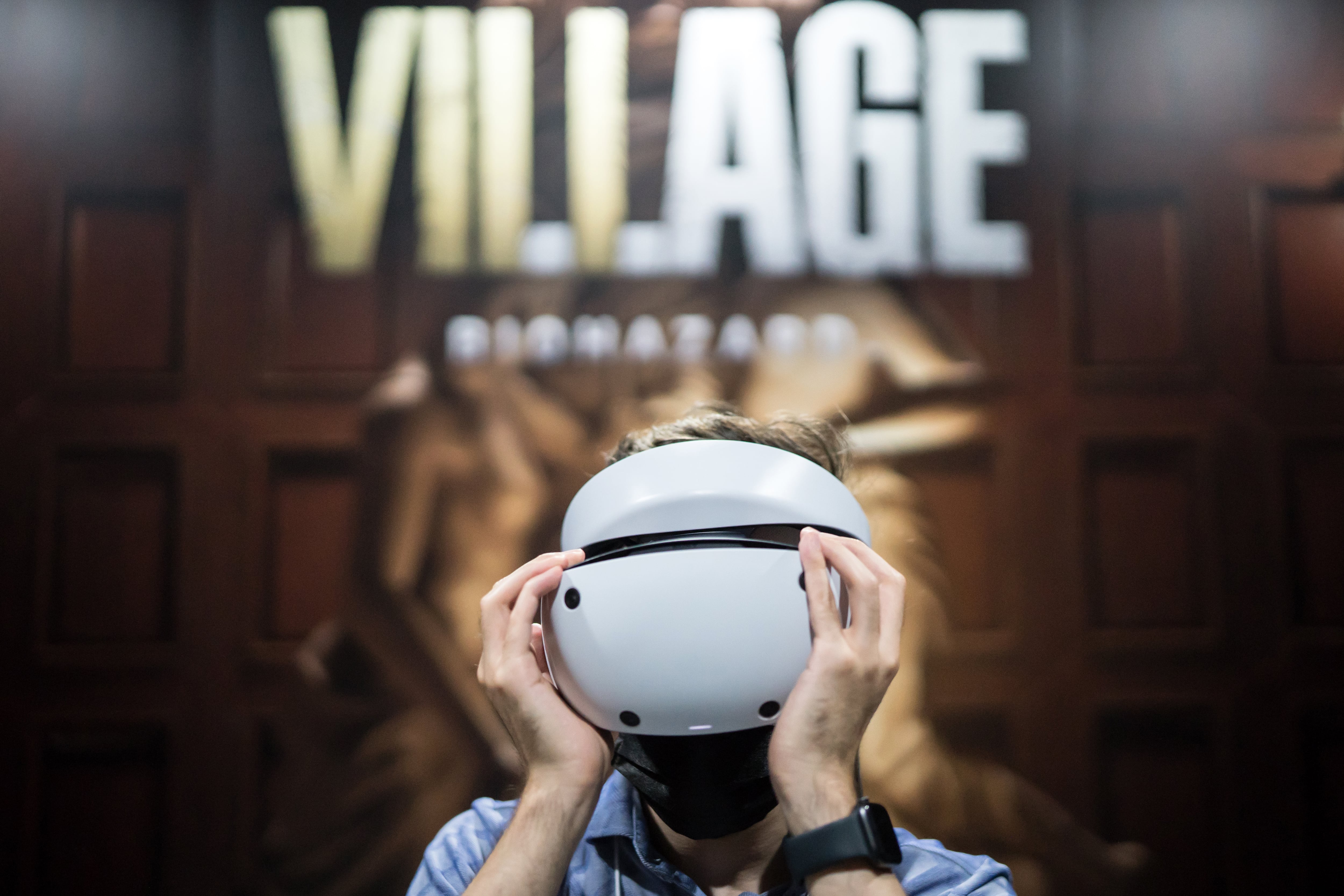 CHIBA, JAPAN - SEPTEMBER 15: An attendee wears a Sony PlayStation VR2 (PS VR2) headset to play the Biohazard Village, known as Resident Evil Village outside of Japan, video game in the Capcom booth at the Tokyo Game Show 2022 on September 15, 2022 in Chiba, Japan. The event runs for four days from September 15-18 and takes place for first time in three years, following a hiatus due to the coronavirus pandemic. (Photo by Tomohiro Ohsumi/Getty Images)