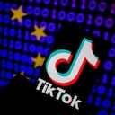 The TikTok logo is seen on a mobile with cyber code displayed on the screen in Brussels, Belgium on March 21, 2023. (Photo Illustration by Jonathan Raa/NurPhoto via Getty Images)