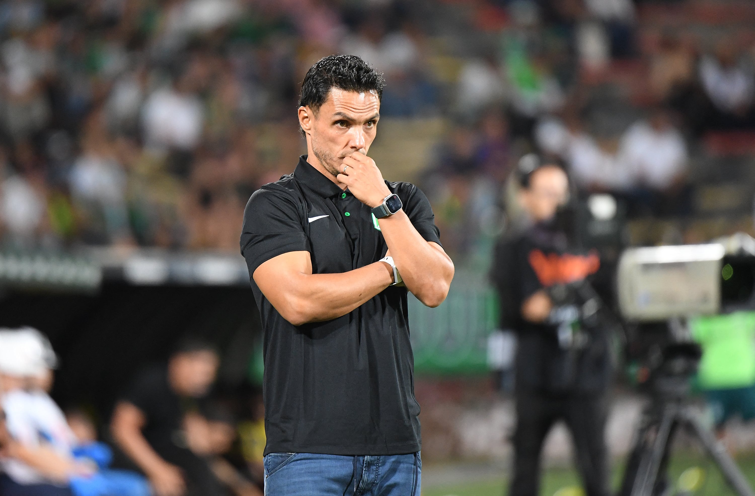 Atletico Nacional's new head coach Lucas Gonzalez looks on during a friendly football match between Colombia's Atletico Nacional and Venezuela's Deportivo Tachira at the Atanasio Girardot stadium in Medellin, Colombia, to raise funds for those affected by the June 24 earthquakes in Venezuela. (Photo by JAIME SALDARRIAGA / AFP)
