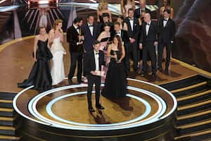 HOLLYWOOD, CALIFORNIA - MARCH 02: Cast and crew including Darya Ekamasova, Lindsey Normington, Vache Tovmasyan, Karren Karagulian, Alex Coco, Mikey Madison, Mark Eydelshteyn, Samantha Quan, Luna Sof�a Miranda, Sean Baker, Drew Daniels and Yura Borisov accept the Best Picture award for "Anora" onstage during the 97th Annual Oscars at Dolby Theatre on March 02, 2025 in Hollywood, California. Kevin Winter/Getty Images/AFP (Photo by KEVIN WINTER / GETTY IMAGES NORTH AMERICA / Getty Images via AFP)