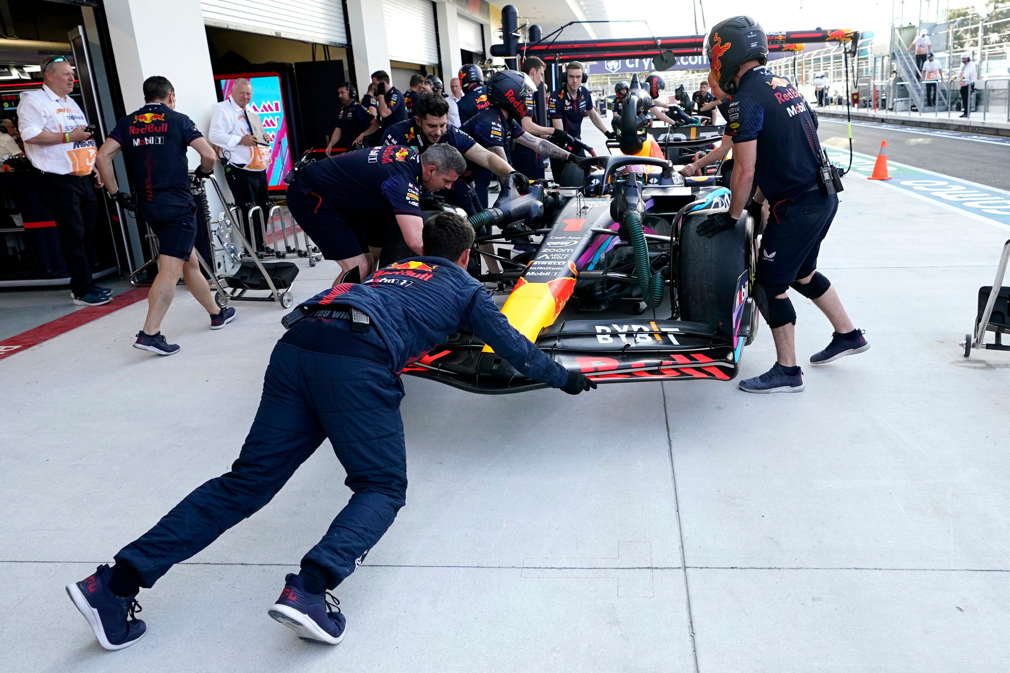 The car of Red Bull driver Max Verstappen, of the Netherlands, is pushed into the garage during the second practice session for the Formula One Miami Grand Prix auto race, Friday, May 5, 2023, at the Miami International Autodrome in Miami Gardens, Fla. (AP Photo/Lynne Sladky)