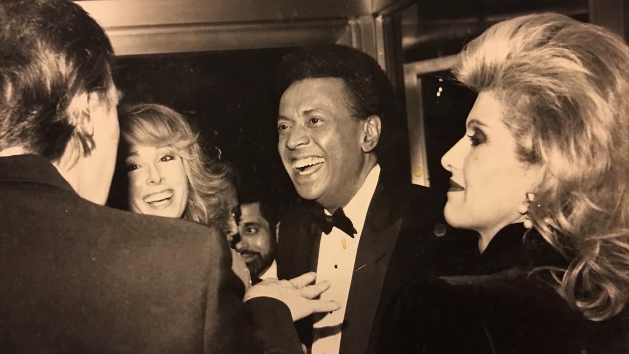 This image released by Kaplan Hecker & Fink and presented as evidence during former President Donald Trump's deposition shows E. Jean Carroll, second from left, and her then-husband John Johnson, center, meeting Trump, at left, and his wife Ivanka at an event in the 1980's. During his deposition, Trump mistook Carroll as Marla Maples, his ex-wife, when shown the image. The video recording of Trump being questioned about the rape allegations against him was made public for the first time Friday, May 5, 2023, providing a glimpse of the Republican's emphatic, often colorful denials. (Kaplan Hecker & Fink via AP)