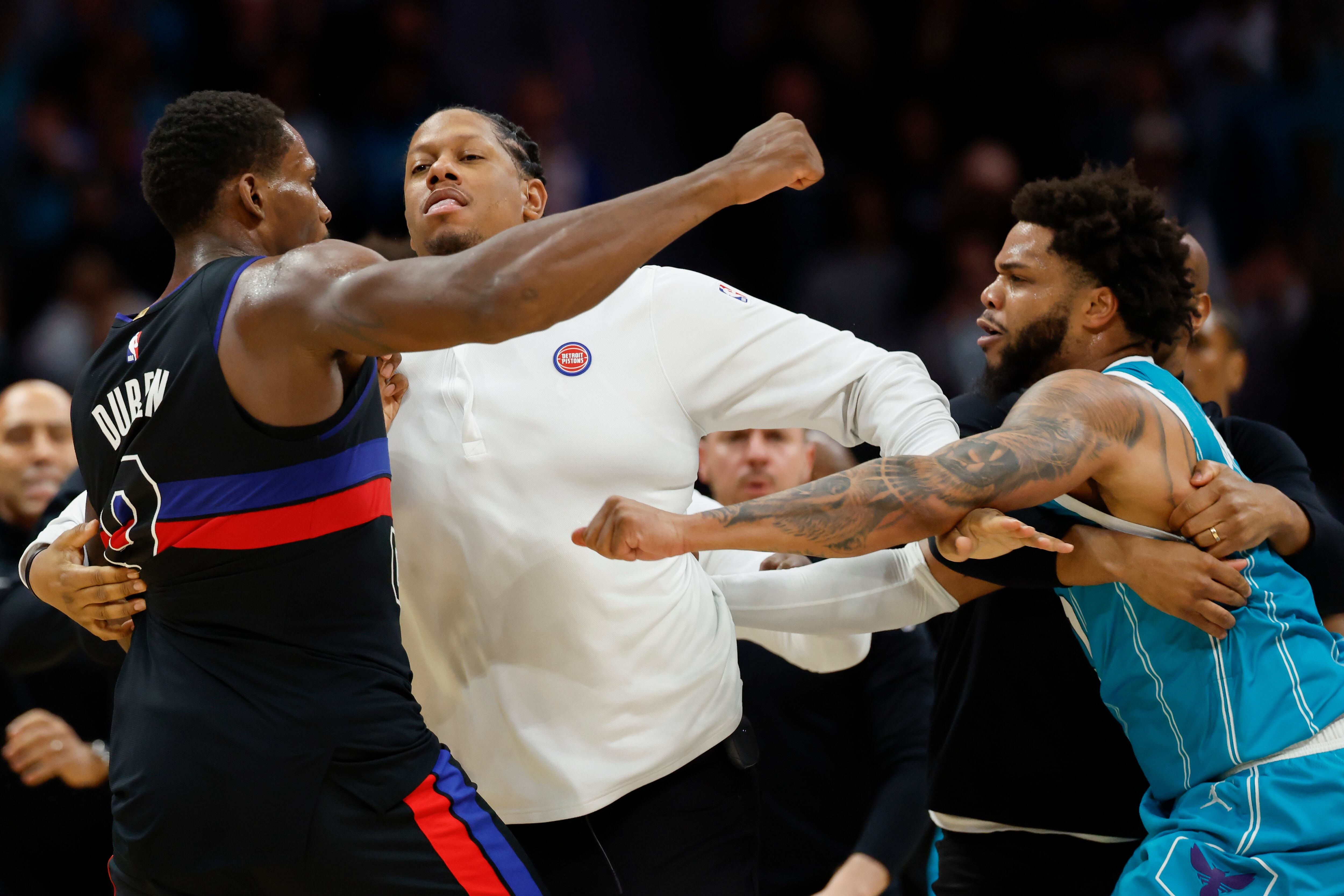 Detroit Pistons center Jalen Duren, left, throws punches with Charlotte Hornets forward Miles Bridges, right, during a fight on the court in the second half of an NBA basketball game in Charlotte, N.C., Monday, Feb. 9, 2026. (AP Photo/Nell Redmond)
