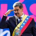 Venezuelan President Nicolas Maduro salutes supporters on his inauguration day for a third term at Miraflores presidential palace in Caracas, Venezuela, Jan. 10, 2025. (AP Photo/Cristian Hernandez)