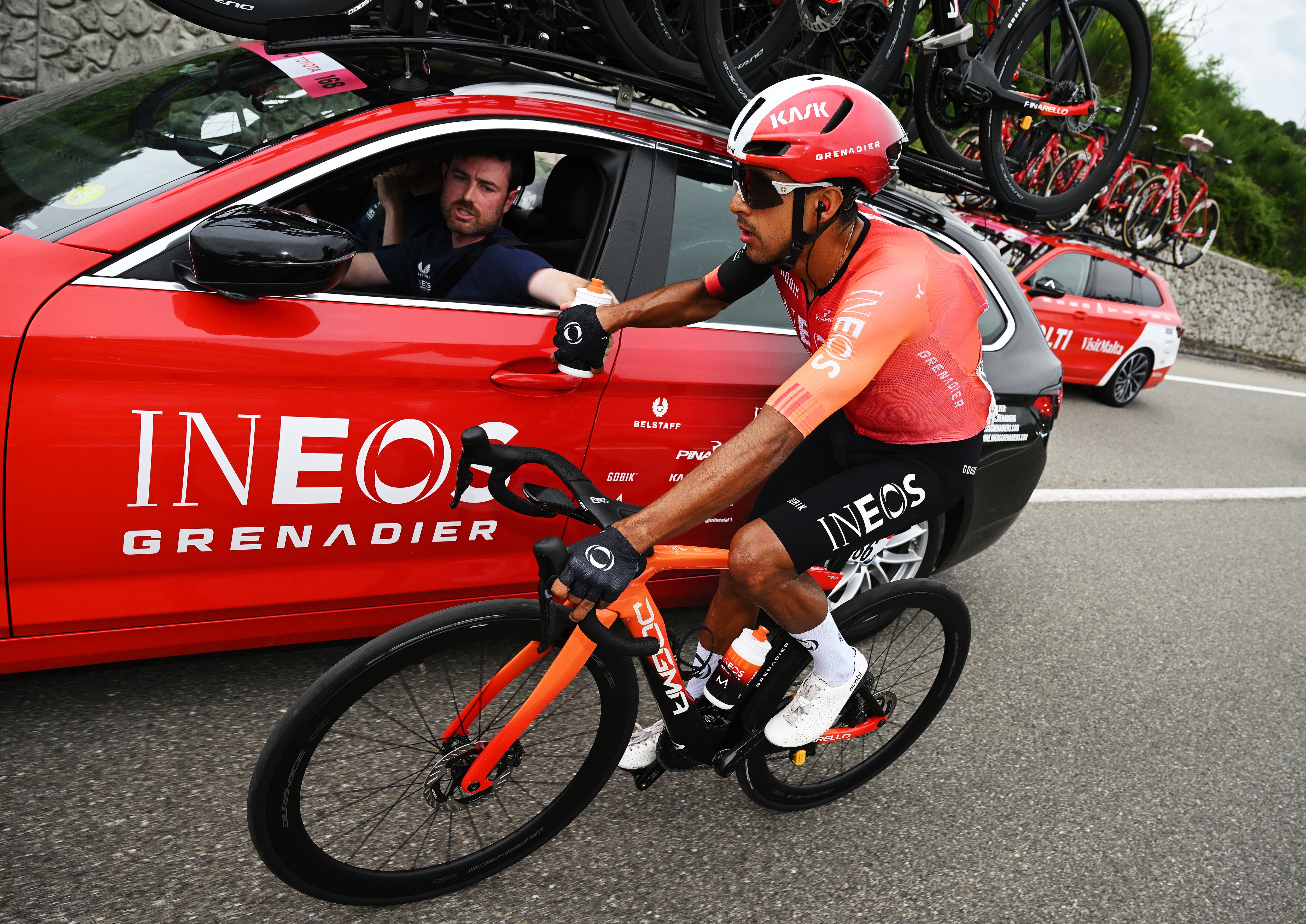 NAPOLI  ITALY - MAY 15: Brandon Smith Rivera of Colombia and Team INEOS Grenadiers assisted by the team car during the 108th Giro d'Italia 2025, Stage 6 a 227km stage from Potenza to Napoli / #UCIWT / on May 15, 2025 in Potenza, Italy. (Photo by  Dario Belingheri/Getty Images)