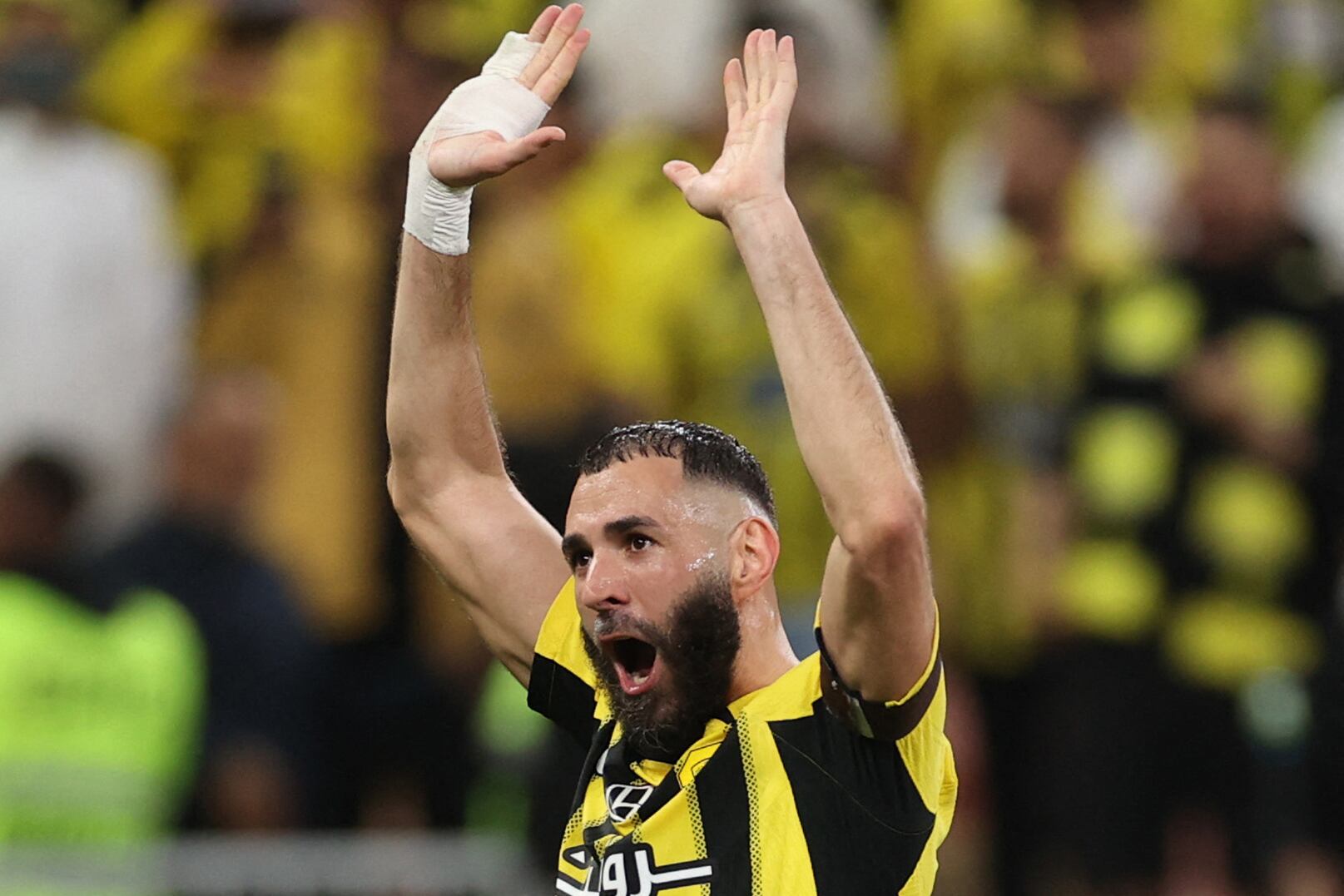 Ittihad's French forward #09 Karim Benzema greets the fans after the Saudi Pro League football match between Al-Ittihad and Al-Hilal at King Abdullah Sports City in Jeddah on February 22, 2025. (Photo by AFP)