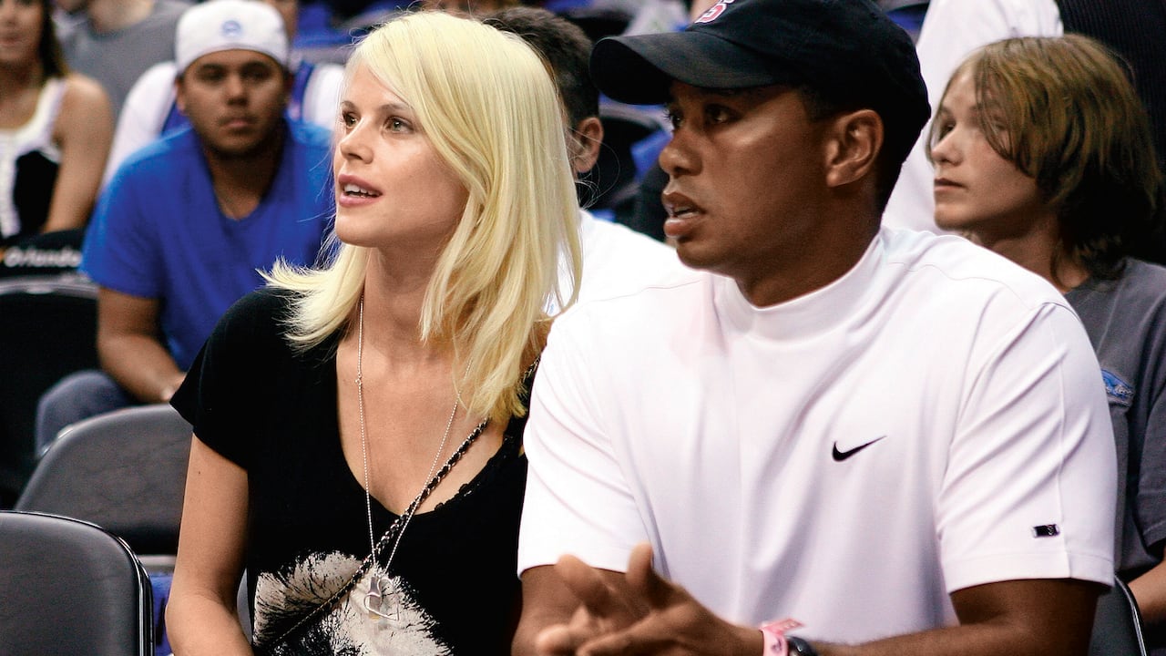 ORLANDO, FL - JUNE 11: Golfer Tiger Woods sits courtside with his wife Elin during Game Four of the 2009 NBA Finals between the Los Angeles Lakers and the Orlando Magic at Amway Arena on June 11, 2009 in Orlando, Florida. The Lakers won 99-91 in overtime and lead the series 3-1. NOTE TO USER: User expressly acknowledges and agrees that, by downloading and or using this photograph, User is consenting to the terms and conditions of the Getty Images License Agreement. (Photo by Elsa/Getty Images)