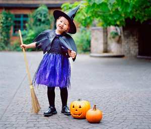 happy child excited waiting to go to trick and treat