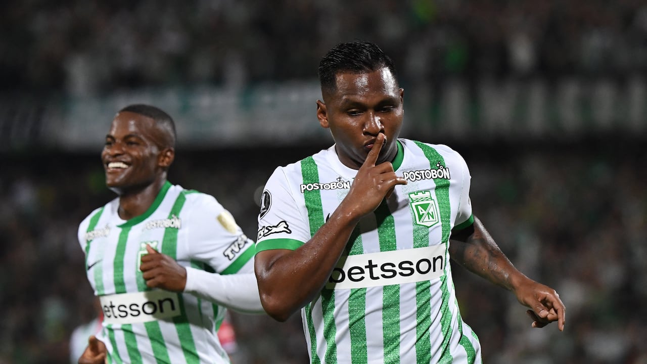 Atletico Nacional's forward #09 Alfredo Morelos (R) celebrates after scoring with teammate defender #06 Andres Roman during the Copa Libertadores group stage first round football match between Colombia's Atletico Nacional and Uruguay's Nacional at the Atanasio Girardot stadium in Medellin, Antioquia department, Colombia, on April 2, 2025. (Photo by Jaime SALDARRIAGA / AFP)